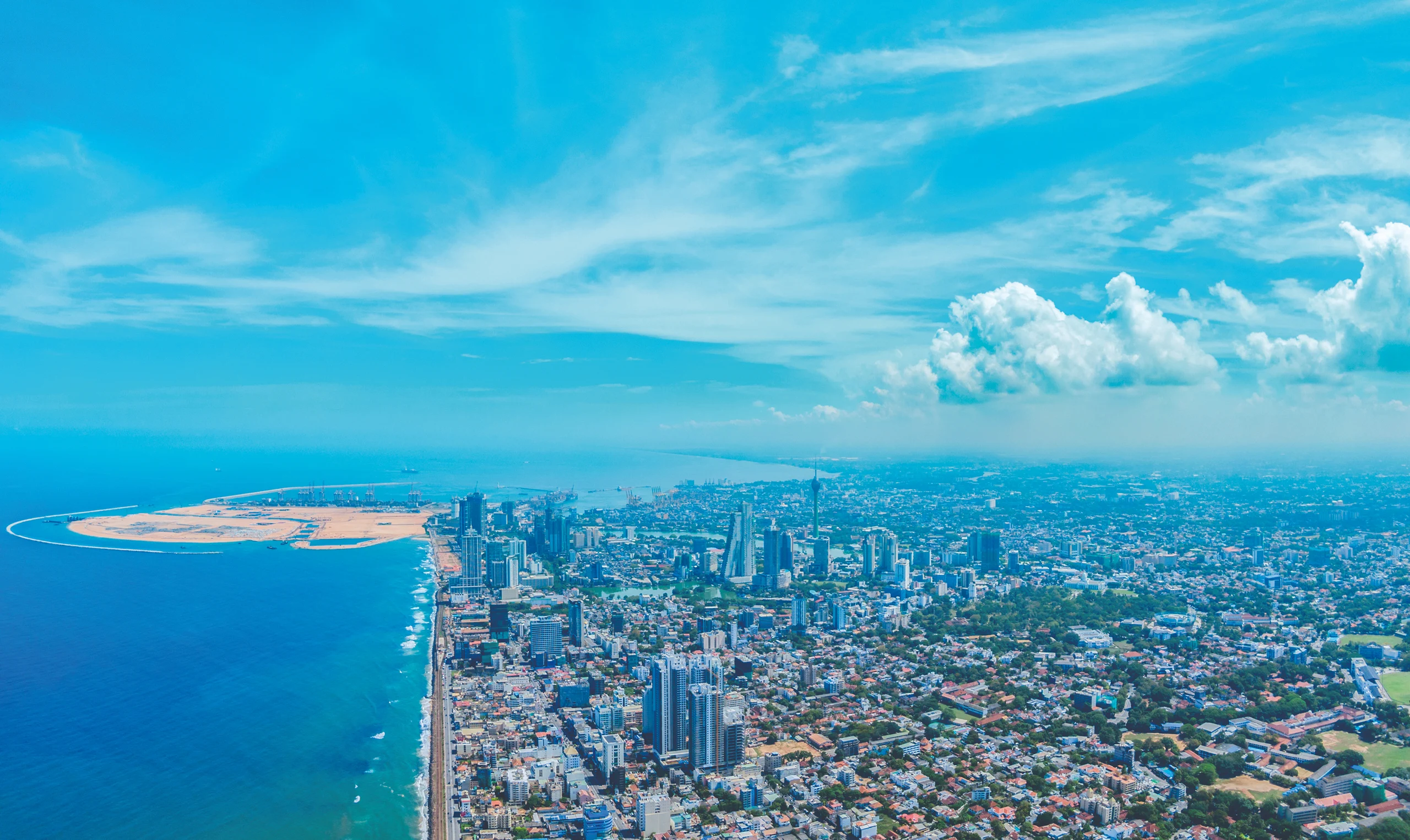 coastal skyline and the reclaimed land of Port City Colombo , Sri Lanka